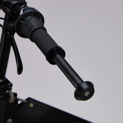upride folding bike bike stand is being stowed inside the handlebar
