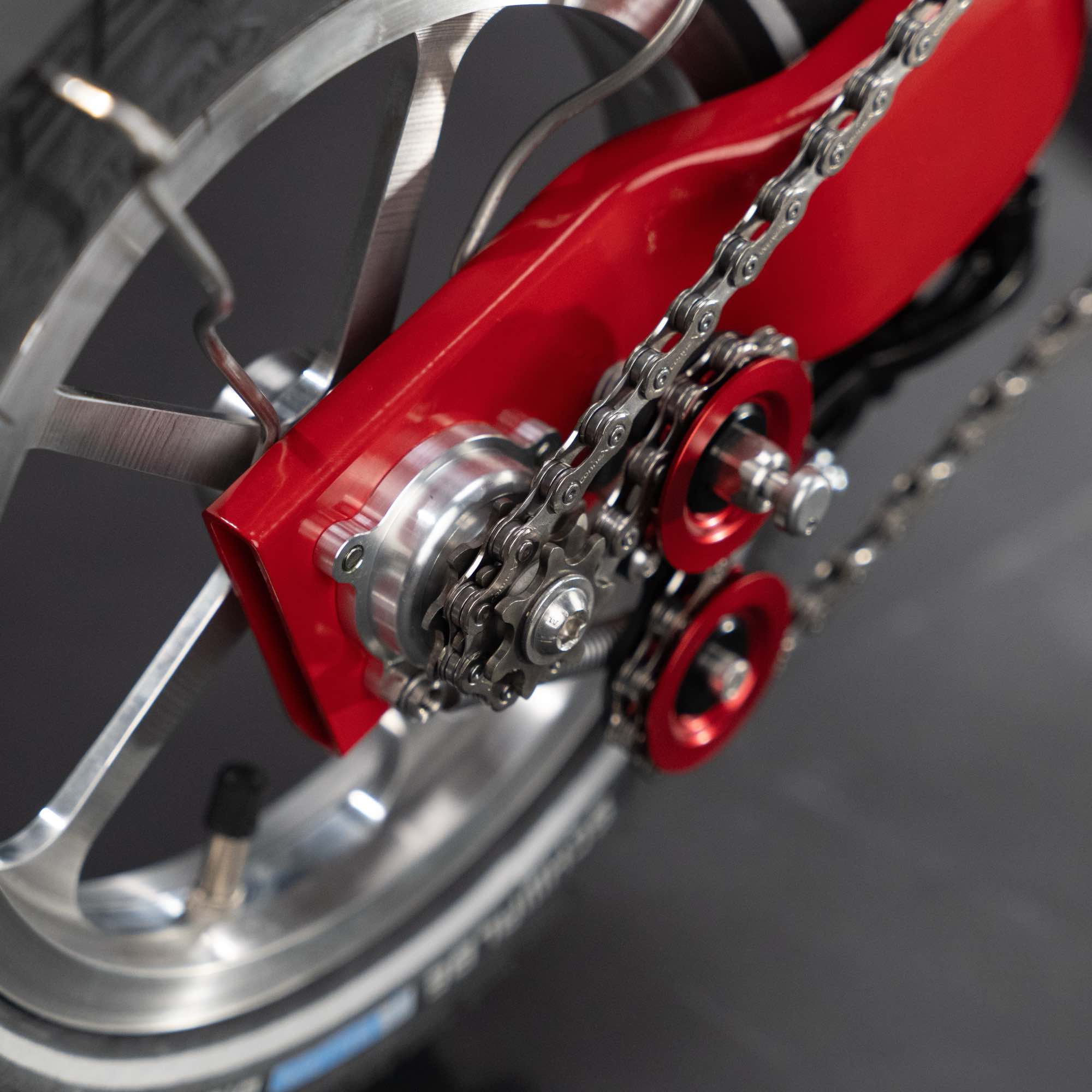 Close-up of the back wheel with rear derailleur and sprockets on the Upride folding bike